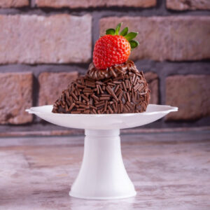 A Chocolate Cake with a Strawberry