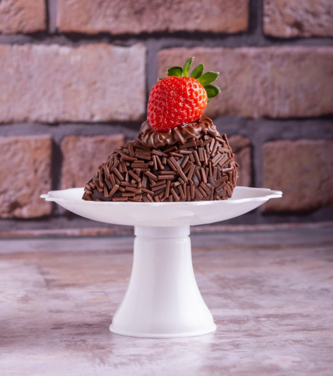 A Chocolate Cake with a Strawberry